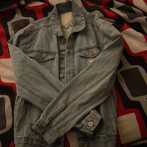 this is a never worn Calvin Klein blue jean jacket. it is a medium